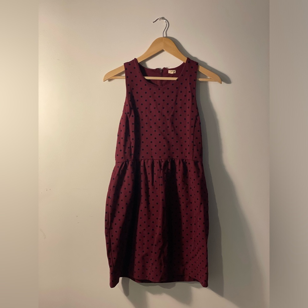 Maroon dress with polka dots.
